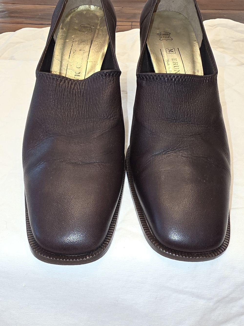 These are elegant women's heeled shoes by Bruno Magli, crafted from high-quality
